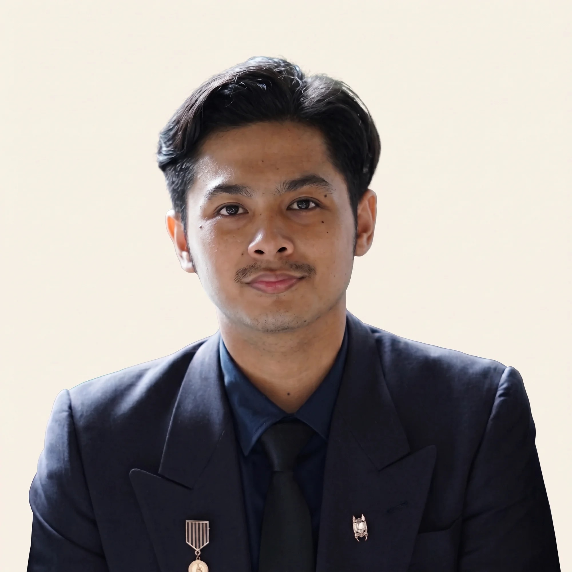 Portrait of Aniq Najmuddin in a dark suit